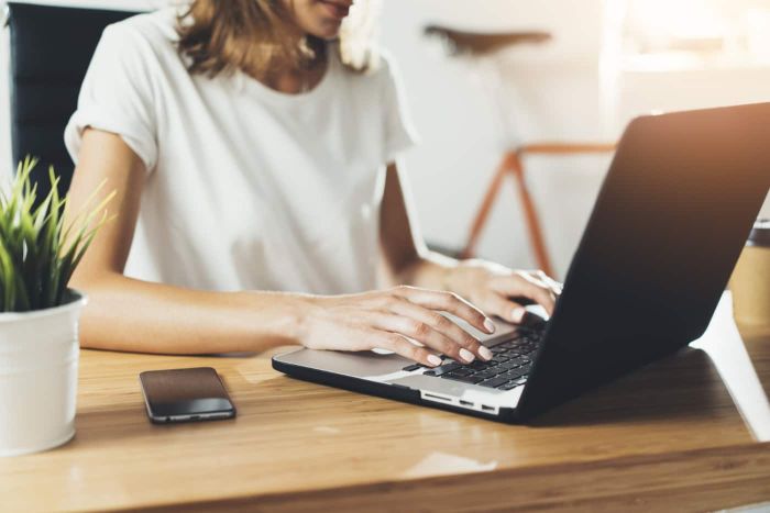 woman typing on computer