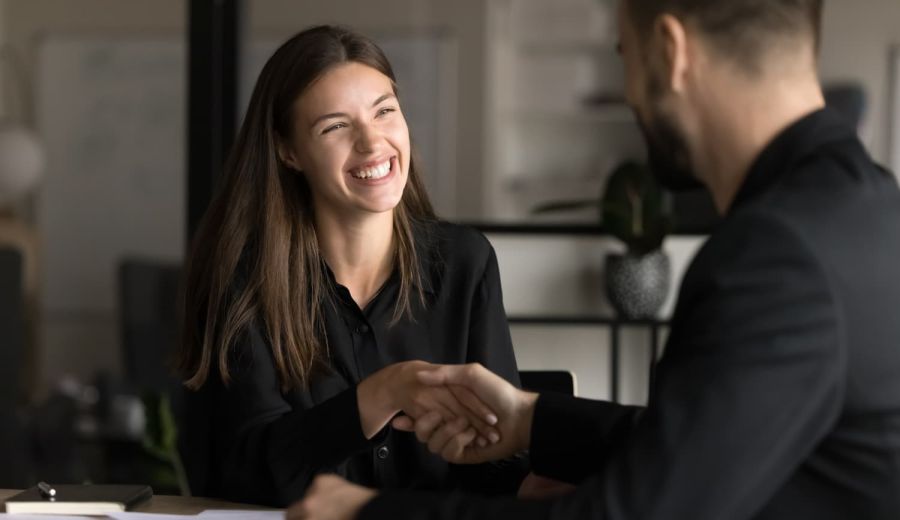 Happy business customer shaking hands