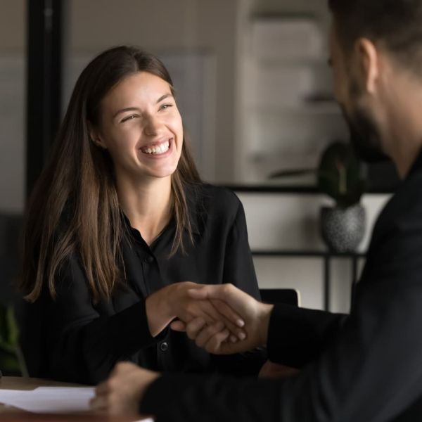 Happy business customer shaking hands